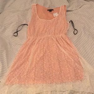 Coral dress with cream lace and elastic waist.